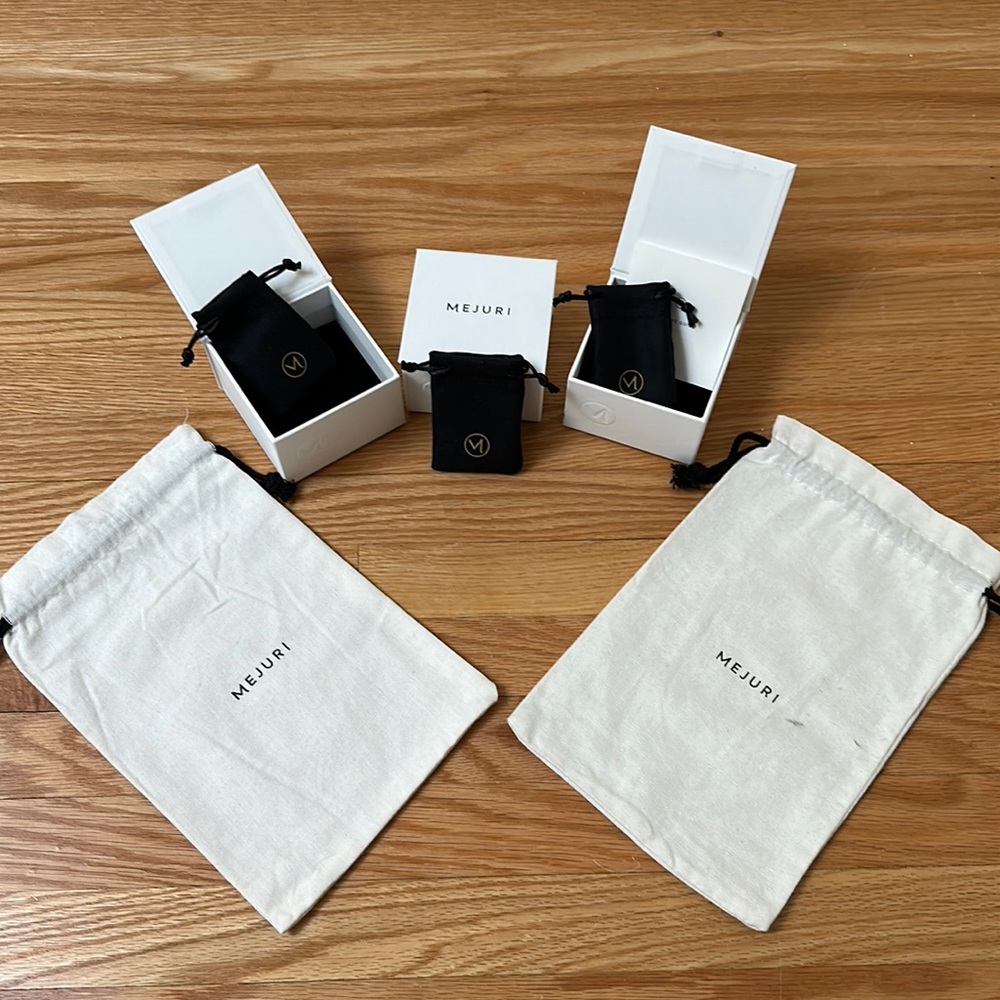 Mejuri boxes (3) black pouches (3) and dust bags (2)